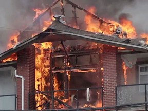 A fire burns at an apartment building in Langley, B.C. (Video screenshot)