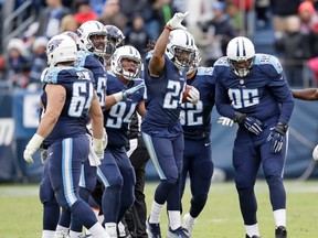 Titans safety Daimion Stafford (24) celebrates after recovering a fumble by Broncos tight end A.J. Derby to stop the Broncos' final drive in the fourth quarter of an NFL game in Nashville, Tenn., on Sunday, Dec. 11, 2016. (James Kenney/AP Photo)