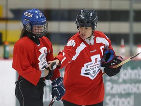 Two-time Olympic gold medallist hockey player Cassie Campbell-Pascall (right) instructs a player during the Girls Hockey Fest in Winnipeg, Man. Sunday December 11, 2016. Brian Donogh/Winnipeg Sun/Postmedia Network