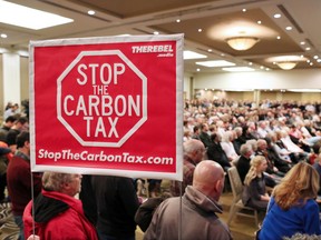 A large crowd listens to Ezra Levant speak during Rebel Media's anti carbon tax rally held at the Westin Hotel in Calgary on Sunday December 11, 2016.  GAVIN YOUNG/POSTMEDIA