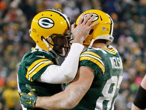 Packers QB Aaron Rodgers (left) congratulates Jordy Nelson (right) after a touchdown catch during second half NFL action against the Seahawks in Green Bay, Wis., on Sunday, Dec. 11, 2016. (Mike Roemer/AP Photo)