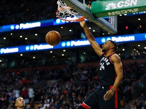 Raptors' Norman Powell dunks during second half NBA action against the Celtics in Boston on Friday, Dec. 9, 2016. (Winslow Townson/AP Photo)
