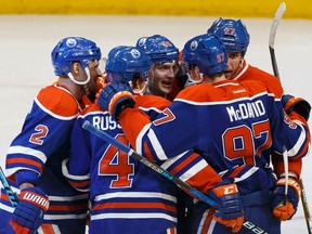 Edmonton's Mark Letestu (55) celebrates a goal with teammates during the third period of a NHL game between the Edmonton Oilers and the Winnipeg Jets at Rogers Place in Edmonton, Alberta on Sunday, December 11, 2016. Ian Kucerak / Postmedia