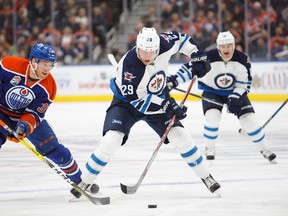 EDMONTON, AB - DECEMBER 11:  Drake Caggiula #36 of the Edmonton Oilers harasses Patrik Laine #29 of the Winnipeg Jets on December 11, 2016 at Rogers Place in Edmonton, Alberta, Canada. (Photo by Codie McLachlan/Getty Images)