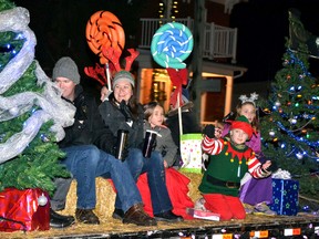 Elves and other Christmas characters threw candy canes and other sweet treats from the back of the parade floats to the spectators gathered in downtown Monkton for the village’s Santa Claus Parade Dec. 3. GALEN SIMMONS MITCHELL ADVOCATE