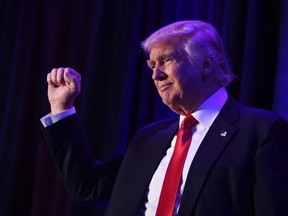 This file photo taken on November 9, 2016 shows US President-elect Donald Trump as he arrives at the New York Hilton Midtown in New York. (AFP PHOTO/SAUL LOEBSAUL LOEB/AFP/Getty Images)