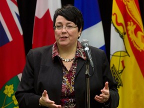 Newfoundland and Labrador Finance Minister Cathy Bennett talks to reporters before the start of a meeting with Federal Finance Minister Bill Morneau and his provincial and territorial counterparts in Ottawa on Dec. 21, 2015. (THE CANADIAN PRESS/Fred Chartrand)