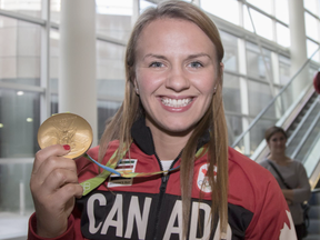 Rio Olympic gold medal wrestler Erica Wiebe returns to Calgary and is greeted by family, friends and fans at the Air Canada arrivals terminal, on August 26, 2016. --  (Crystal Schick/Postmedia