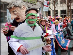 The Raging Grannies, a group of feisty older women organized around the world, will watch in horror while Stephen Harper places gags on scientists, librarians and backbench MPs. But the Grannies cannot be muzzled and will break into song about this outrage before chasing Stephen Harper away. A scientist, librarian, and Conservative MP are muzzled by Stephen Harper while the outraged Grannies watch. PHOTO by Bruno Schlumberger-The Ottawa Citizen/Files