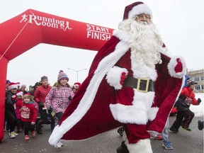 Santa and a host of helpers start the Santa shuffle event for the Salvation Army at Tunney's Pasture Saturday morning. DARREN BROWN / OTTAWA CITIZEN
