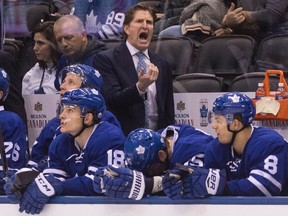 Leafs head coach Mike Babcock issues instructions from the bench as his team plays the Avalanche in Toronto on Sunday. (Chris Young/The Canadian Press)