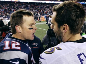 New England Patriots quarterback Tom Brady (12) and Baltimore Ravens quarterback Joe Flacco (5) speak at midfield after an NFL football game, Monday, Dec. 12, 2016, in Foxborough, Mass. (AP Photo/Steven Senne)