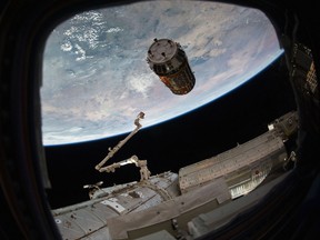 This photo provided by NASA TV shows a Japanese cargo ship before it arrives with Christmas gifts to the International Space Station on Tuesday, Dec. 13, 2016. The capsule — called Kounotori, or white stork — contains nearly five tons of food, water, batteries and other supplies. NASA said there also are Christmas presents for the two Americans, three Russians and one Frenchman on board. (NASA TV via AP)