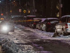 Toronto Police at the scene on Seaton St. after a woman was hit by a car as it was being stolen late Monday, Dec. 12, 2016. (Victor Biro photo)
