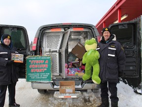 Auxiliary Constable Jonathan Thomas and Auxiliary Staff Sergeant Ralph Johnson were stationed outside of Canadian Tire accepting toys from patrons.