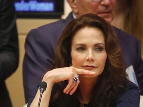 In this Oct. 21, 2016 file photo, Lynda Carter, who played Wonder Woman on television, listens during a U.N. meeting to designate Wonder Woman as an "Honorary Ambassador for the Empowerment of Women and Girls," at U.N. headquarters. (AP Photo/Bebeto Matthews)