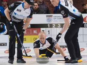Team Jacobs members (left to right) Ryan Harnden, Brad Jacobs and E.J. Harnden during Grand Slam of Curling competition.