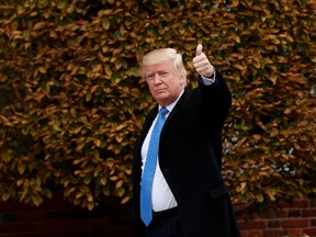 President-elect Donald Trump waves as he arrives at Trump International Golf Club for a day of meetings, November 20, 2016 in Bedminster Township, New Jersey. (Drew Angerer/Getty Images)