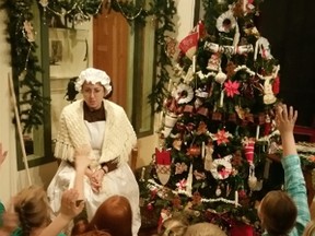 Moore Museum's Amanda Moorehouse tells the tale of Lambton County Christmases past during the museum's Old-Fashioned Christmas school program.
Submitted photo for SARNIA THIS WEEK