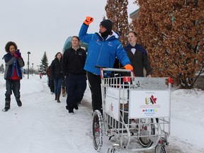 Joe Roberts with the Push for Change campaign walks with students at the Woodstock Community Complex on Tuesday, Dec. 13, 2016. (MEGAN STACEY/Sentinel-Review)