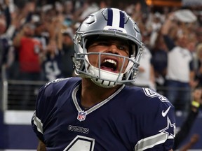 Dak Prescott #4 of the Dallas Cowboys celebrates after scoring a touchdown during the fourth quarter against the Washington Redskins at AT&T Stadium on November 24, 2016 in Arlington, Texas. (Photo by Tom Pennington/Getty Images)