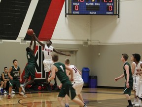 Two early-season games are hoped to prepare the Jasper Place Rebels senior boys for the annual Rebel invitational basketball tournament that starts Thursday. Here, senior Ally Sendagire moves to block a Spruce Grove Panthers shot in an 89-70 victory which evened the Jasper Place record at 1-and-1, two days after the St. Peter the Apostle Spartans recorded an 82-75 victory in the first regular-season game for both teams. (Supplied photo)