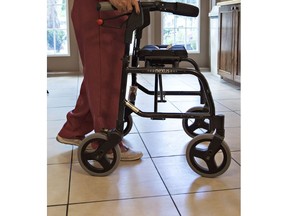 A senior uses a walker in an image to illustrate stories on seniors and long-term care facilities. Photographed on Thursday September 15, 2016 in Brantford, Ontario. Brian Thompson/Brantford Expositor/Postmedia Network
