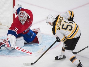 Boston Bruins' Ryan Spooner scores on Montreal Canadiens' Carey Price during overtime in Montreal on Dec. 12, 2016. (THE CANADIAN PRESS/Graham Hughes)