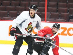Mark Borowiecki (left) of Ottawa Senators hits Tom Pyatt during practice on Tuesday at Canadian Tire Centre. (Jean Levac/Postmedia Network)