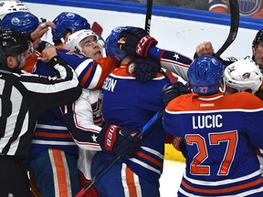 Edmonton Oilers and the Columbus Blue Jackets rough things up in front to the Oilers net during the second period of NHL action at Rogers Place on Wednesday. (Ed Kaiser)