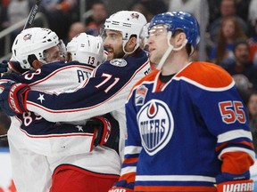 Columbus Bllue Jackets players celebrate Sam Gagner's second-period gaol against the Oilers Tuesday at Rogers Place. (The Canadian Press)