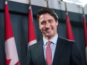 Justin Trudeau smiles at the end of a press conference in Ottawa on Oct. 20, 2015. (NICHOLAS KAMM/AFP/Getty Images)