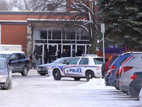 London police have Wheable adult education school on lockdown after someone saw a man with what looked like a handgun, and neighbours heard gunshots on Wednesday, December 14, 2016. Craig Glover/The London Free Press/Postmedia Network