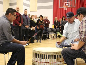 Aamjiwnaang First Nation members Lightning Clark, Matt Isaac and Nim Plain drum for a crowd of local dignitaries gathered at the Maawn Doosh Gumig Community and Youth Centre Wednesday. Community leaders gathered for the signing of a new water and sewer service agreement between the City of Sarnia and Aamjiwnang First Nation. (Barbara Simpson/Sarnia Observer)