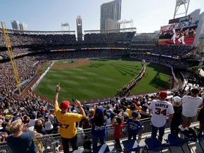 Fans cheer during the National Anthem prior to MLB's All-Star Game in San Diego on July 12, 2016. As part of the new labour agreement between the league and players, the winner of the all-star game will no longer determine home-field advantage in the World Series. (Jae C. Hong/AP Photo/Files)