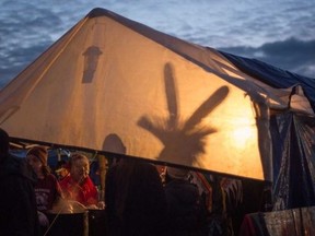 Philip Norton/Special To Postmedia Network
A light throws a silhouette against a tent wall as "water protectors" protesting the Dakota Access oil pipeline settle in for the evening at one of three camps along the Missouri River in North Dakota.