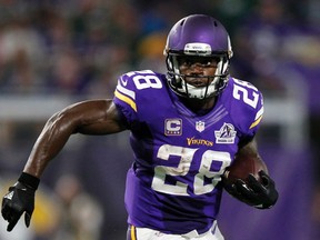 In this Sept. 18, 2016, file photo, Minnesota Vikings running back Adrian Peterson carries the ball during the first half of an NFL football game against the Green Bay Packers, in Minneapolis. (AP Photo/Andy Clayton-King, File)