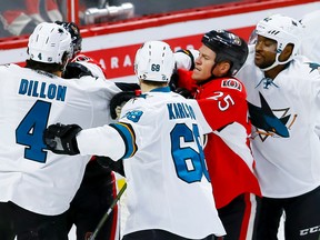 Ottawa Senators right wing Chris Neil (25) in the thick of it as usual against the San Jose Sharks during NHL action at the Canadian Tire Centre on Wednesday December 14, 2016. Errol McGihon/Postmedia