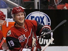 Arizona Coyotes right wing Shane Doan smiles after it was announced Doan earned an assist on a goal by Max Domi during a game against the Calgary Flames on Dec. 8, 2016, in Glendale, Ariz. For the Coyotes' Doan, it was his 554th career assist, making him the team leader in that category. (ROSS D. FRANKLIN/The Associated Press)