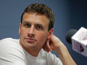 In this May 12, 2016, file photo, Ryan Lochte listens to a question from the media in Charlotte, N.C. Lochte and fiancee Kayla Rae Reid announced on Dec. 14, 2016, that they are expecting a baby. (AP Photo/Chuck Burton, File)