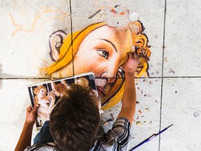 Embrun artist, Francois Pelletier, beautifies the street during 25th Annual Ottawa International Buskerfest along Sparks St. in Ottawa