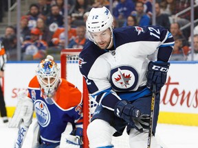 Edmonton goalie Cam Talbot keeps his eye on the puck as Winnipeg Jet Drew Stafford looks for a shot last Sunday night. (Codie McLachlan/Getty Images)