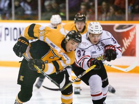 Kingston Frontenacs’ Jason Robertson and the Owen Sound Attack's Nick Suzuki chase the puck during Ontario Hockey League action at the Harry Lumley Bayshore Centre in Owen Sound on Dec. 10. (James Masters/Postmedia Network)