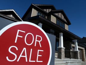 A sign advertises a new home for sale in Carleton Place, Ont. on  March 17, 2015. (THE CANADIAN PRESS/Sean Kilpatrick)