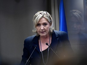 French far-right Front National (FN) party president, member of European Parliament and candidate for France's 2017 presidential election, Marine Le Pen delivers a speech during a meeting about healthcare, on December 9, 2016 in Paris. / AFP PHOTO / MARTIN BUREAUMARTIN BUREAU/AFP/Getty Images