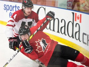 Team Canada's Blake Speers is knocked down by University All-Stars Jordan Murray during first period World Junior hockey exhibition action Tuesday, December 13, 2016 in Boisbriand, Que.THE CANADIAN PRESS/Ryan Remiorz