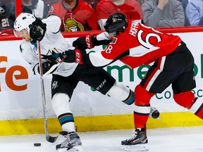 Ottawa Senators left wing Mike Hoffman (68) checks San Jose Sharks right wing Kevin Labanc (62) during NHL action at the Canadian Tire Centre on Wednesday December 14, 2016. Errol McGihon/Postmedia