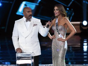 Host Steve Harvey (L) listens as Miss Colombia 2015, Ariadna Gutierrez Arevalo, answers a question during the interview portion of the 2015 Miss Universe Pageant at The Axis at Planet Hollywood Resort & Casino on December 20, 2015 in Las Vegas, Nevada. Gutierrez went on to be named the first runner-up. (Photo by Ethan Miller/Getty Images)