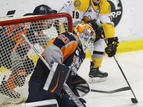Sarnia Sting forward Ryan McGregor shoots the puck at Flint Firebirds goalie Connor Hicks from behind the icing line at Progressive Auto Sales Arena during the Ontario Hockey League game on Thursday, Dec. 15, 2016 in Sarnia, Ont. McGregor scored on his first shift in his return to the lineup after a three-game absence. (Terry Bridge/Sarnia Observer)