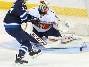 Nikolaj Ehlers has a shot boocked by Florida Panthers goalie Roberto Luongo. (BRIAN DONOGH/Winnipeg Sun)